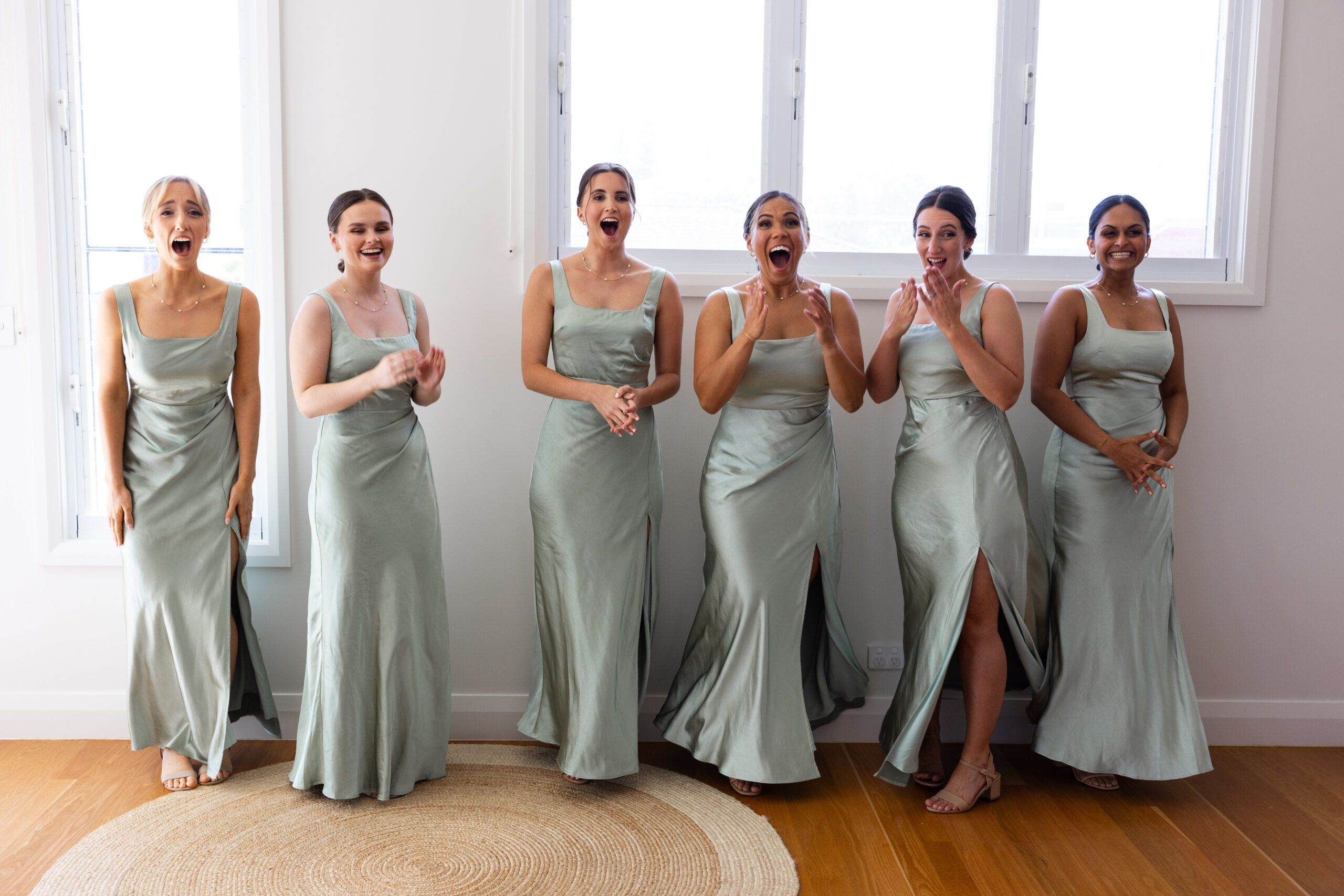 Newlyweds surrounded by the people they love on their wedding day